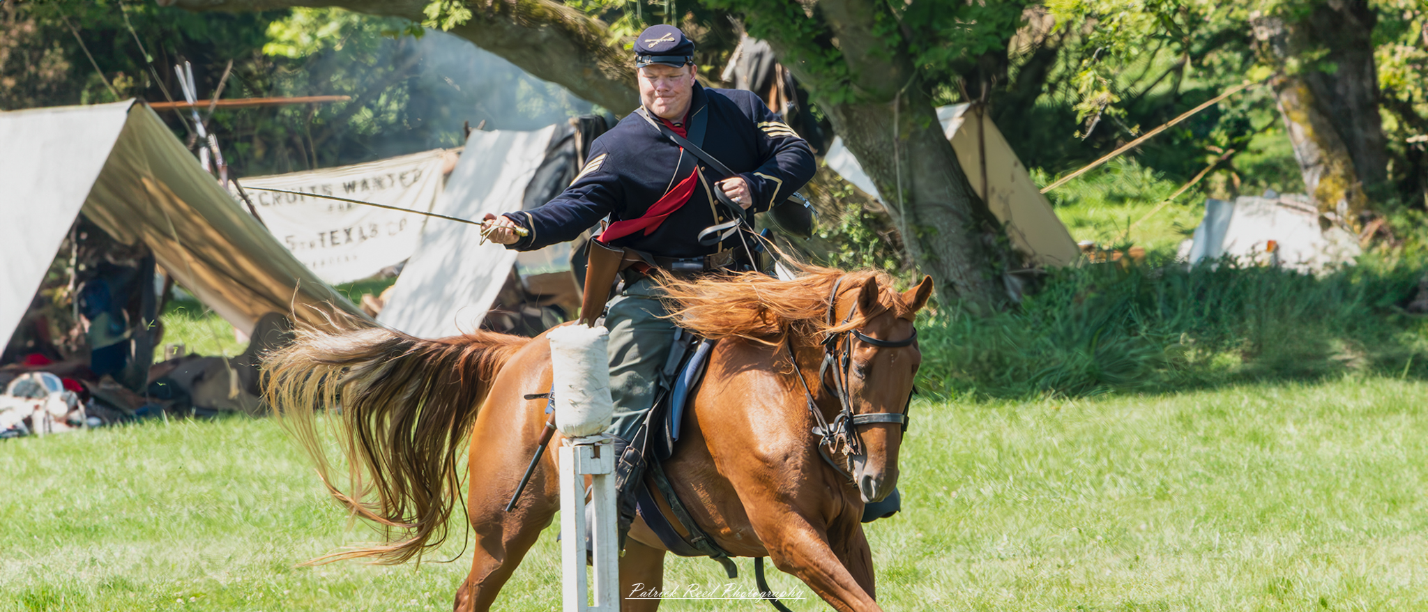 A cavalry soldier swinging a saber with determination, mounted on horseback. Dressed in a traditional uniform, the soldier's expression reflects focus and intensity, capturing the action and bravery involved in cavalry combat during the charge.